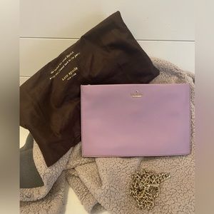 Kate Spade envelope clutch with detachable gold crossbody strap.